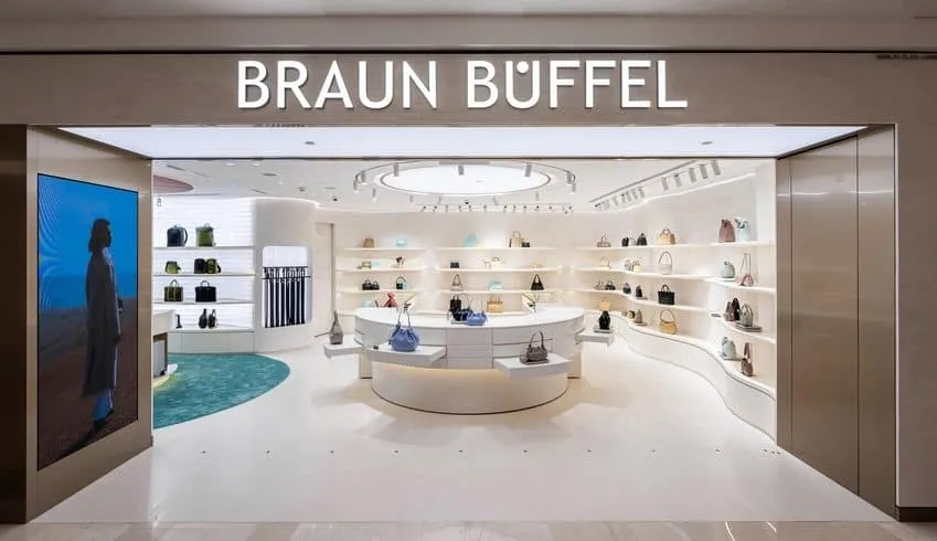 Braun Büffel Kuala Lumpur store design with innovative LED screen, attracting Millennial shoppers.